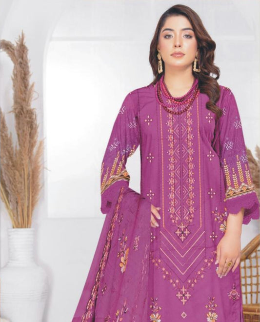 Woman wearing a purple embroidered outfit with fabric details on a white background